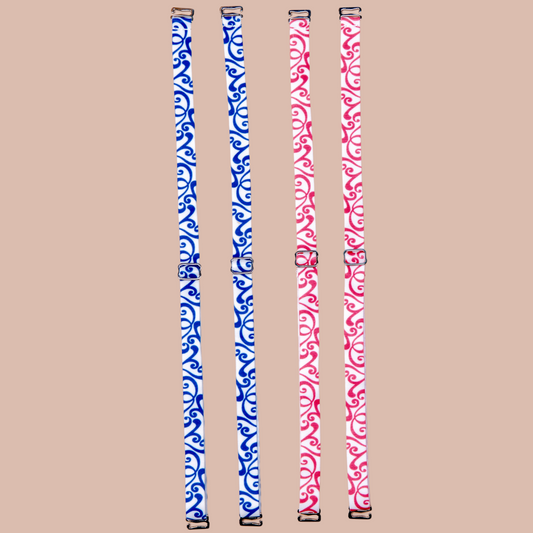Right: Roll'n Blues Her-Rah Straps - white straps with blue swirling pattern. Left: Rock'n Red Her-Rah Straps - white straps with red swirling pattern.