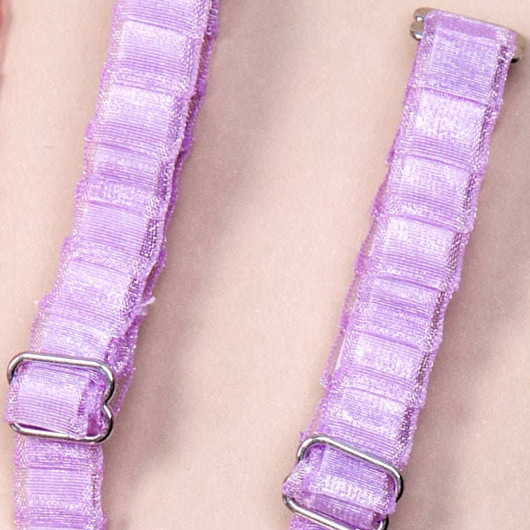 Close up on a set of interchangeable her-rah bra straps in a pleated organza patterns with a sheer shimmer to the fabric in color Lavender..
