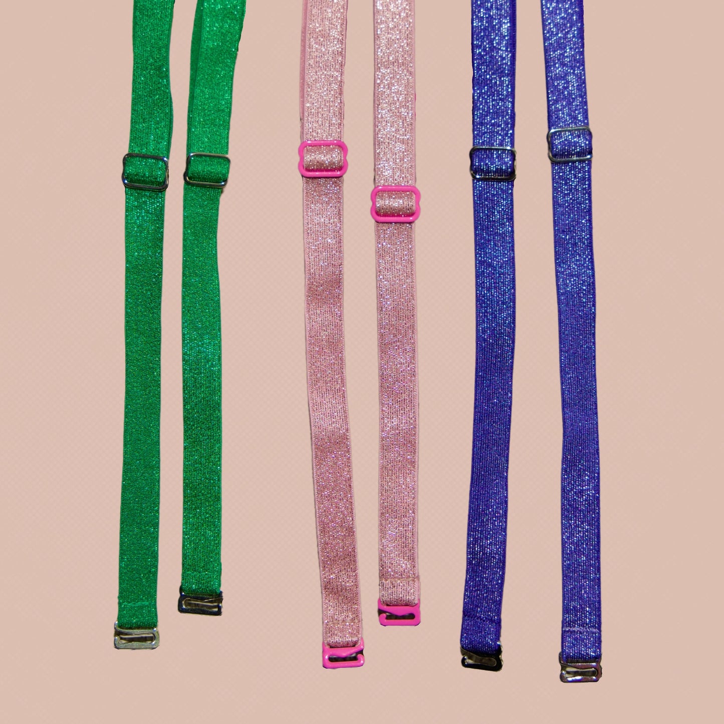 3 sets of Metallic interchangeable her-rah Straps, from left to right: Emerald Green, Princess pink, Royal Blue.