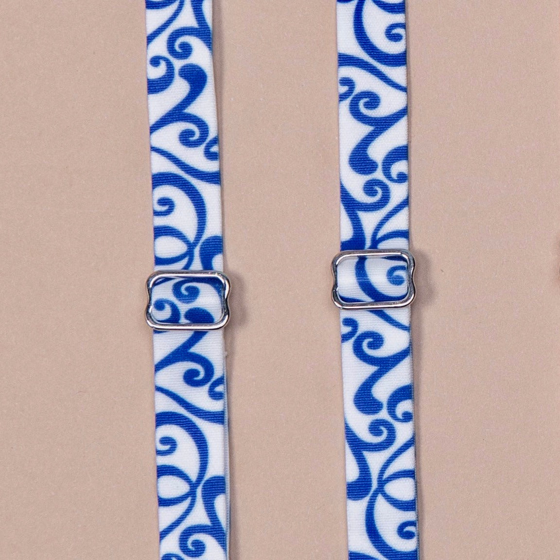 Roll'n Blues Her-Rah Straps - white straps with blue swirling pattern.