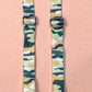Close up of green camo bra straps featuring silver metal hardware.