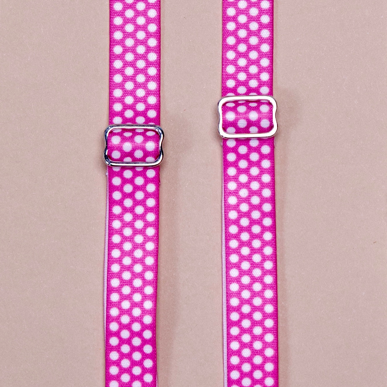 Strawberry Polka Her-Rah Straps - Dark pink strap with small uniform light pink polka dots repeating the length of the strap, featuring metal hardwear.
